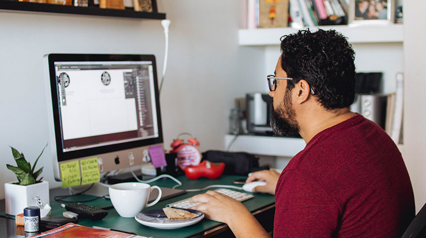 freelance designer sitting at computer