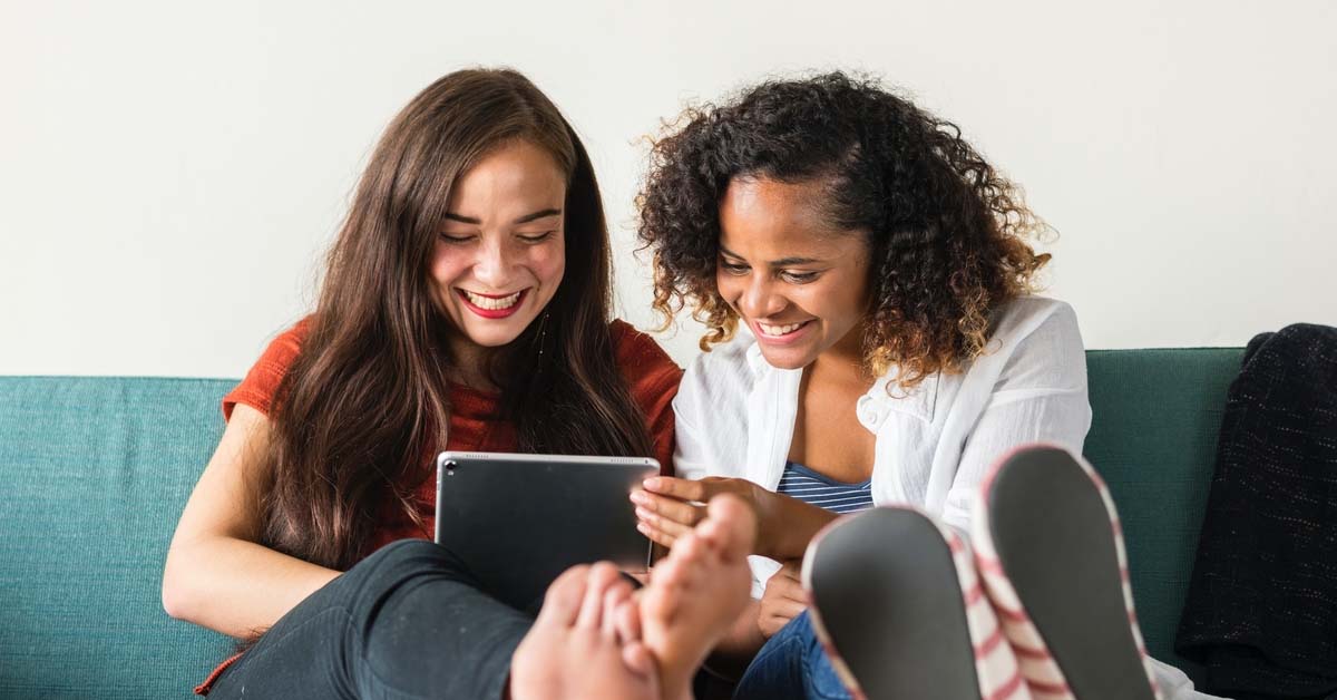 women talking and laughing