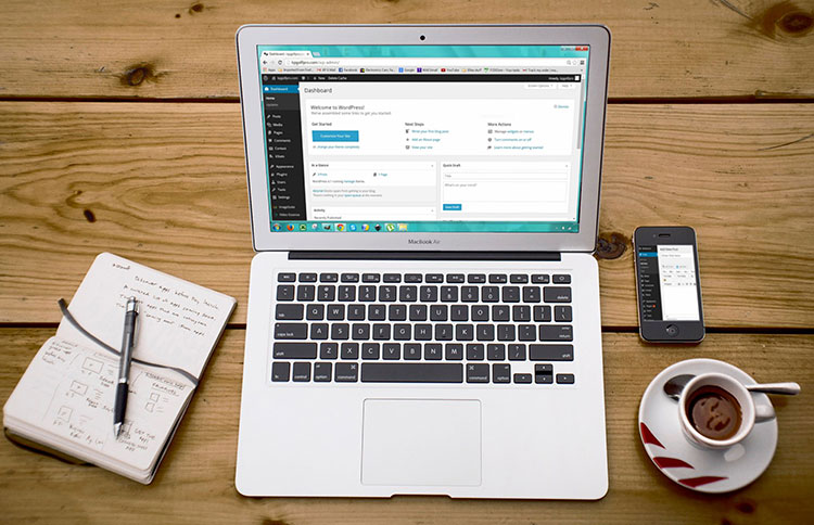 A laptop on a desk with WordPress open