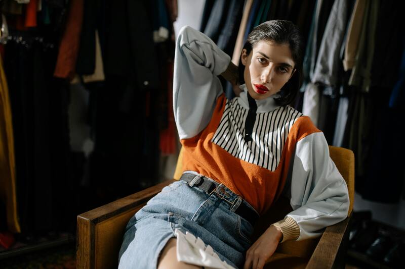 woman sitting in a chair while posing