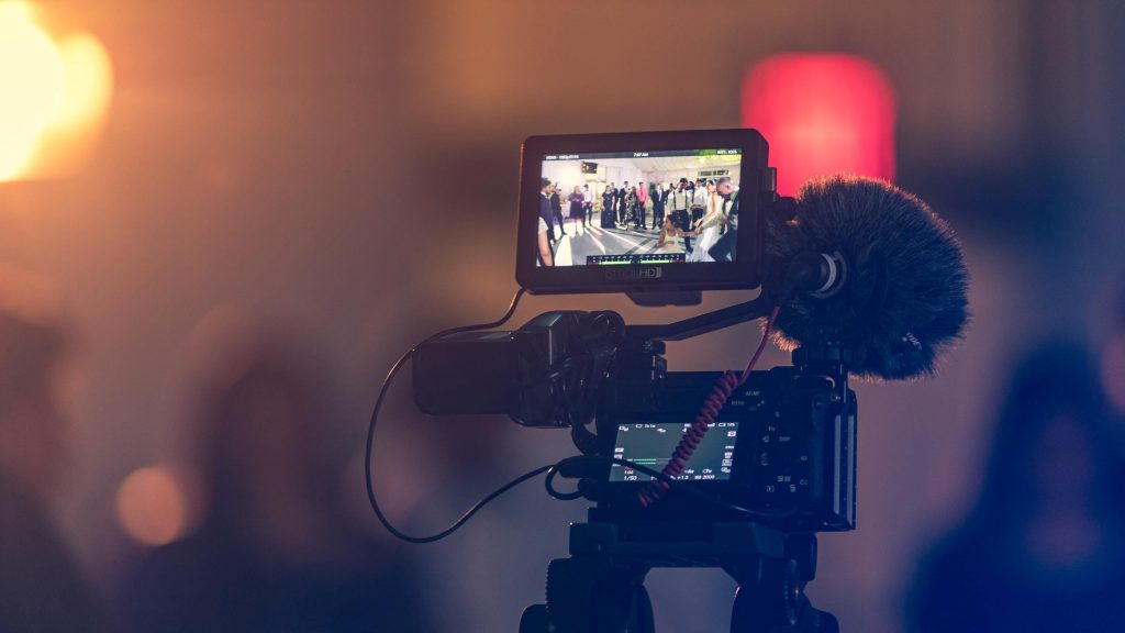 An expensive camera on a tripod.video marketing