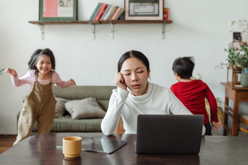 Stock image of a remote worker with noisy kids