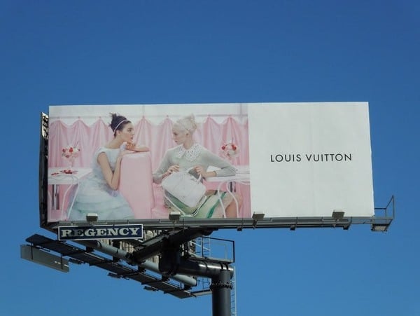 Driving Towards Advertising Billboard With Louis Vuitton Logo