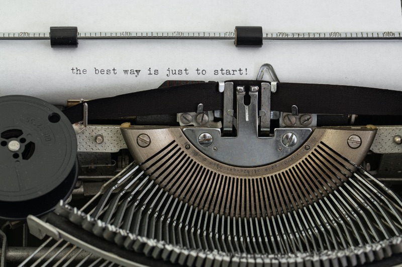 A typewriter typing "the best way is just to start!"