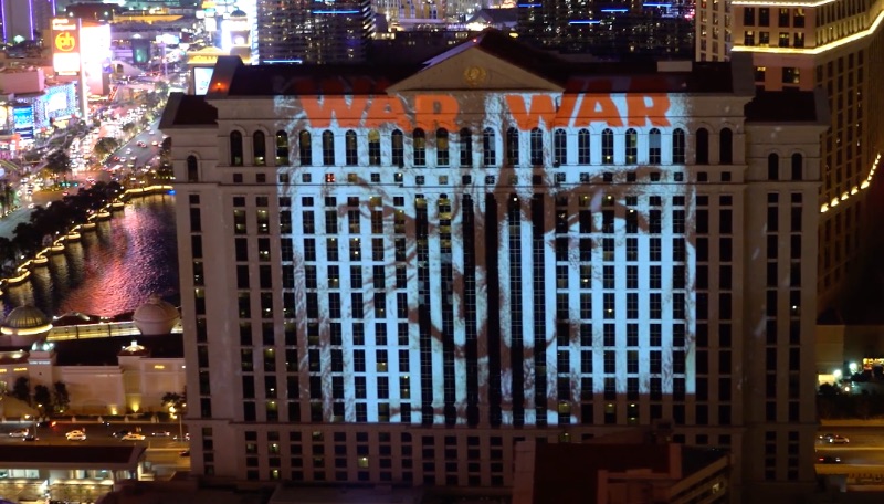 Ad for War for the Planet of the Apes projected onto Caesar's Palace in Las Vegas, created by Studio Number One graphic design firm