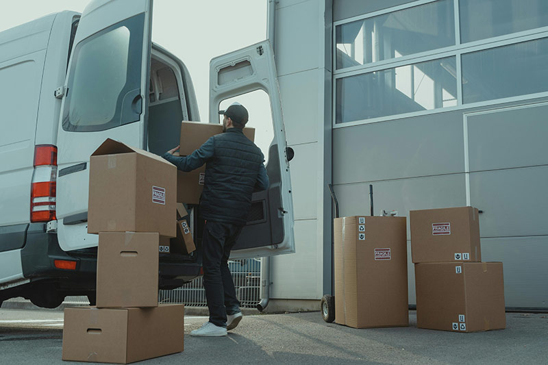 man carrying box