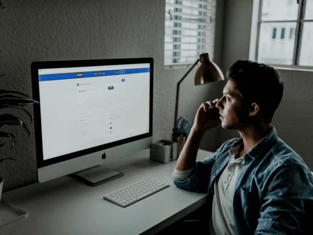 man looking at his computer screen