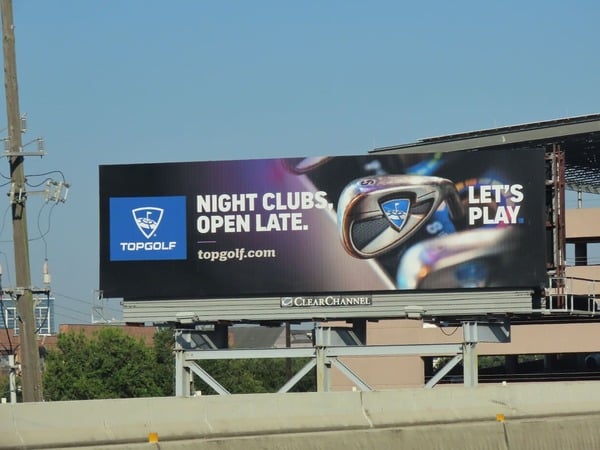 Top Golf billboard on highway