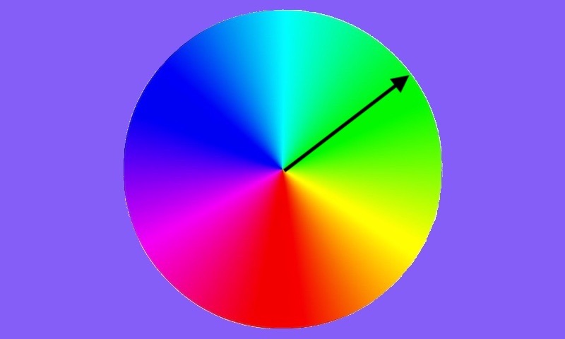 A color wheel with a black arrow pointing from the center to the edge