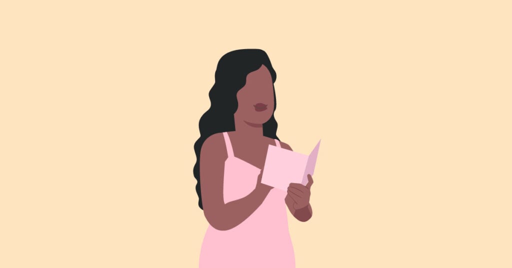 woman reading wedding invite
