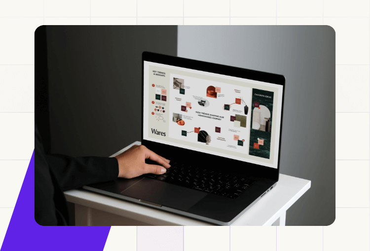 a hand on a laptop with images of custom graphic design services